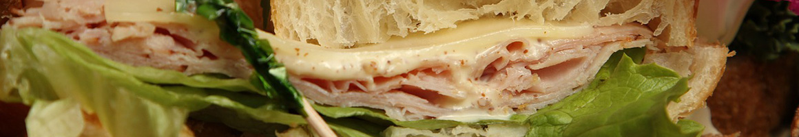 Eating Deli Sandwich at Ventura Sandwich Company restaurant in Ventura, CA.